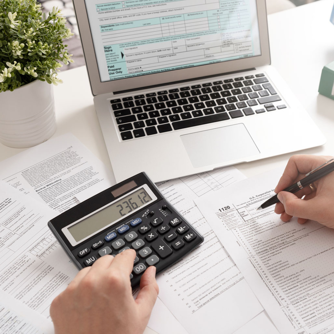 Tax accountant with computer and calculator